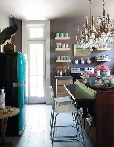 Taxidermied Peacock on a Teal Fridge