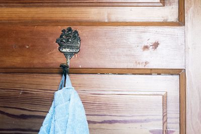 Blue Towels and Brass Sailing Ship Hook