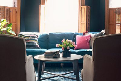 Teal Sofa, Black Walls, Blue Loloi Rug | Making it Lovely