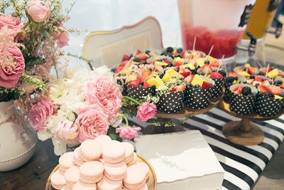 Pink Macarons, Fruit, Watermelon-Infused Water, and Mimosas