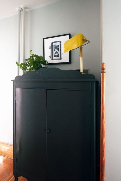 Armoire as Linen Storage in the Hallway, with Art Above
