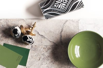 Travertine Tile with Black, White, Gold, and Vivid Green Accents