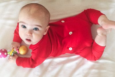 Six Month Old Baby in a Red Union Suit