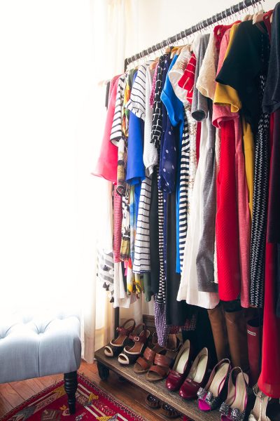 Dresses Hanging on an Industrial Garment Rack, Shoes Below | Making it Lovely's Closet