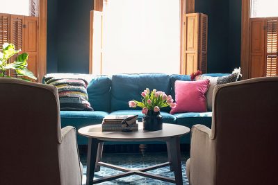 Teal Sofa, Black Walls, Blue Loloi Rug | Making it Lovely