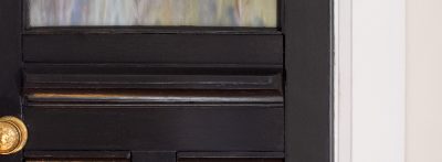 Painted Black Office Door with Brass Knobs | Making it Lovely