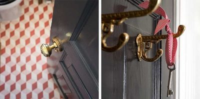 Bathroom with Brass Hardware on a Black Door