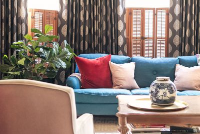 Teal Sofa in Front of Custom Curtains from The Shade Store | Making it Lovely