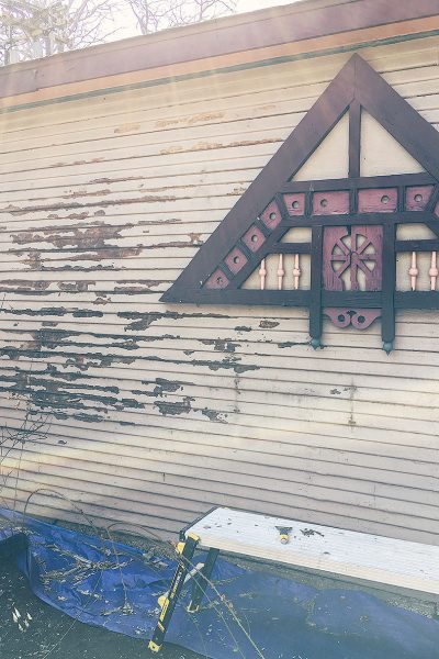 Scraping old paint off of the garage