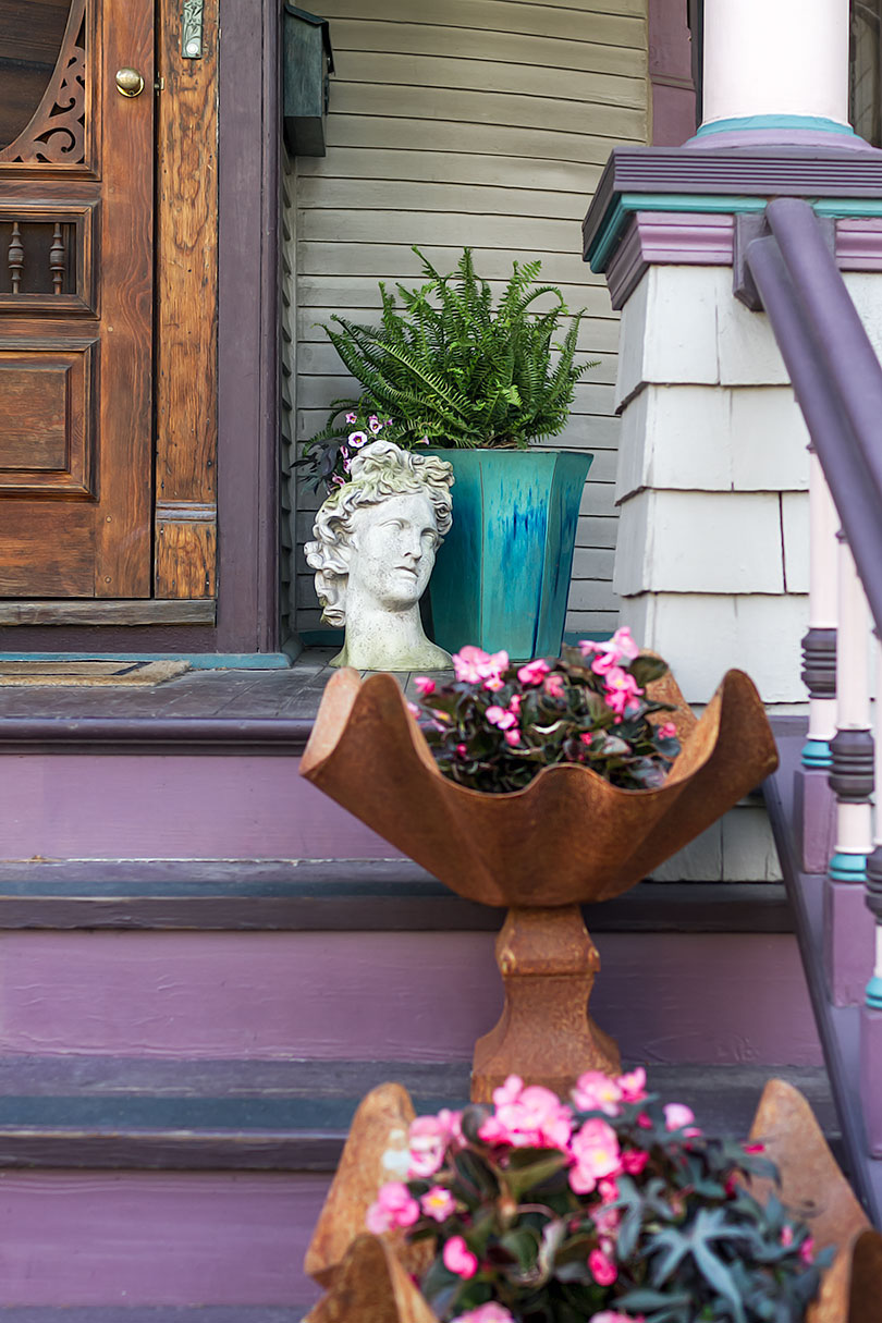 Victorian Front Porch with Curved and Apollo Bust Planters | Making it Lovely