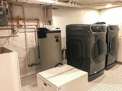 Laundry Room Cabinets, Washer, and Dryer, Plus Hot Water