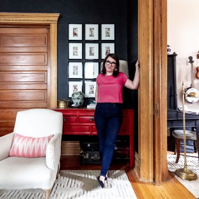 Nicole of Making it Lovely, Black Living Room with Framed Grid of Tarot Card Art