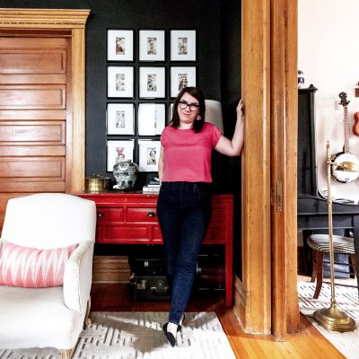 Nicole of Making it Lovely, Black Living Room with Framed Grid of Tarot Card Art