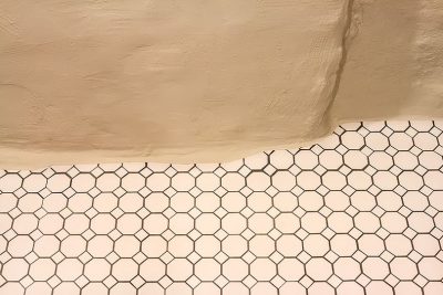 Floor Tile Along Stone Foundation Wall