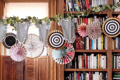 Baby Shower Decorations — Onesies and Colorful Paper Party Fans | Making it Lovely