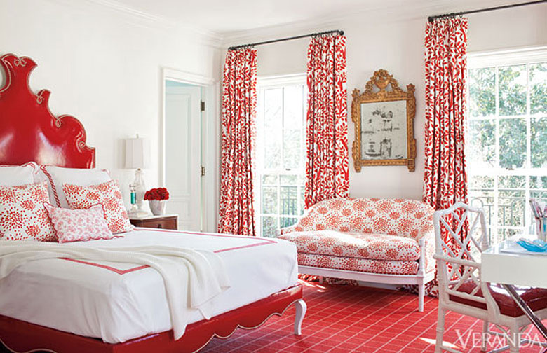 Red Patterned Curtains and Upholstered Red Bed in a Bedroom