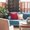 Teal Sofa in Front of Custom Curtains from The Shade Store | Making it Lovely